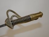 a very old looking sword that is on display