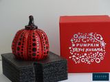 a red box with a black and white pumpkin on it