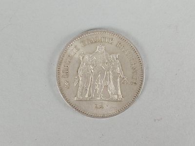 an image of a coin on a white surface
