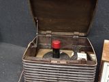 an old radio sitting next to a box with a radio in it