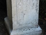 a statue of a cat sitting on top of a pedestal