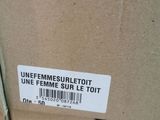 a box with a sticker on it that says unfemme bibliott