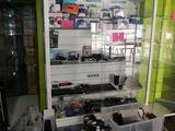 a display case filled with electronics in a store