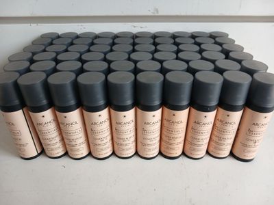 a close up of a bunch of bottles of makeup on a table