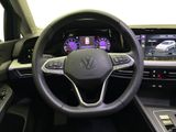 the interior of a car with a steering wheel and dashboard controls