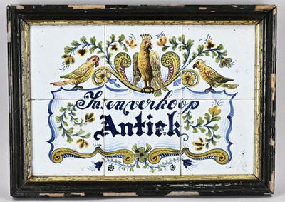 a picture of a tile with birds and flowers on it
