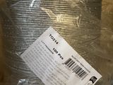 a roll of tin foil wrapped in plastic on a table