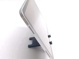 a cell phone that is sitting on top of a stand