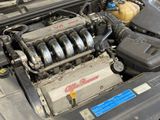 a car engine with the hood up and the engine bay open