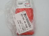a red object in a plastic bag on a white surface