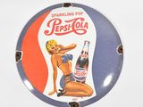 a picture of a pepsi cola sign on a wall