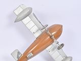 a toy airplane that is sitting on a white surface