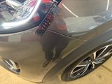 a car that has a sticker on the front of it