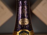 a close up of a bottle of wine on a table
