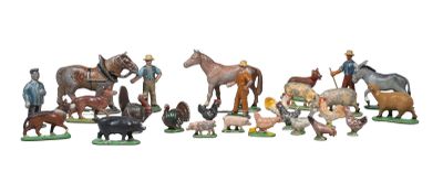 many figurines of farm animals on a white background