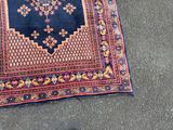 a rug on the ground next to a pair of shoes