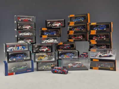 many different models of cars in a display case