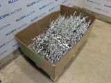 a cardboard box filled with lots of silver pieces