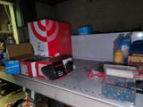 a shelf with boxes and other items on it in a garage