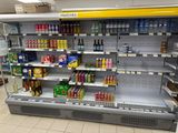 a large display of drinks and beverages in a store