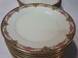 a lot of plates that are sitting on a table