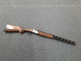 a shotgun that is laying on a table