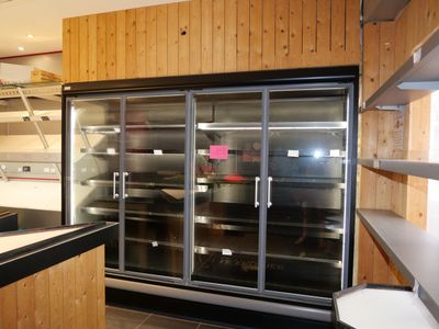 an image of a kitchen with a refrigerator in it