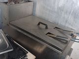 a stove with a pan on top of it in a kitchen