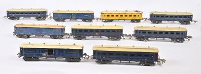 a lot of toy trains that are lined up on a table