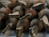 a pile of nuts that are on a table