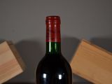 a bottle of wine that is sitting on a table