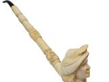 an image of a carved pipe with a woman wearing a hat