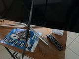 a flat screen tv sitting on top of a wooden table