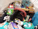 a pile of toys and other items on the floor