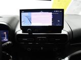 a car dashboard with a laptop on it and a cell phone on the dashboard