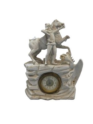 a statue of a man and a dog on a boat