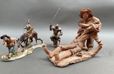 trois figurines représentant des personnes à cheval et un homme sur un traîneau