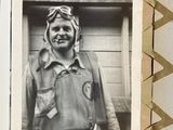 a black and white photo of a man in a pilot ' s uniform