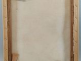 an old picture frame with a piece of paper taped around it