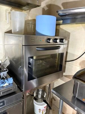 a kitchen with a stove, oven, and other appliances in it