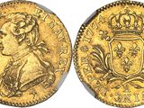 a gold coin with a crown on top of it