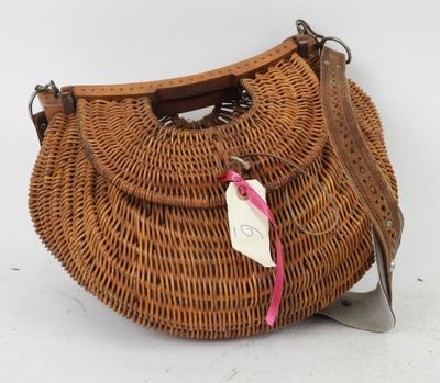 an image of a wicker purse with a tag on it