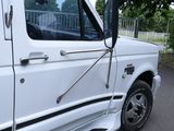 a white truck that is parked on the side of the road