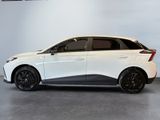 a white and black car parked in a garage