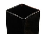 a black square vase that is sitting on a white surface