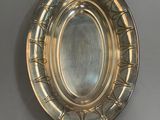 a silver plate on the wall with a handle
