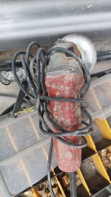 a close up of a car ' s engine with a bunch of wires attached to it