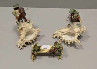 three figurines that are sitting on a table
