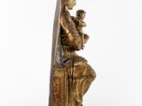 a statue of a woman holding a baby on her lap