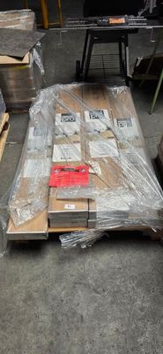 a lot of boxes and pallets on the floor
